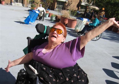 Resident Donna stands outside on the Center Park balcony only a few years ago. 
