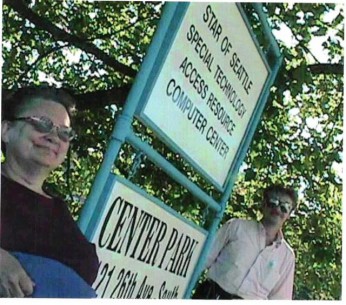Old photo of Donna infront of Center Park and STAR Center signs outside infront of the building. 